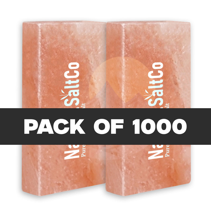 Two pink salt blocks with 'SaltCo' branding on a white background, labeled as a pack of 1000.