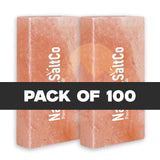 Two pink salt blocks with 'SaltCo' branding on a white background, labeled as a pack of 100.