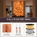 Himalayan salt wall kit with salt bricks, glue, and LED strip light in a home setting.