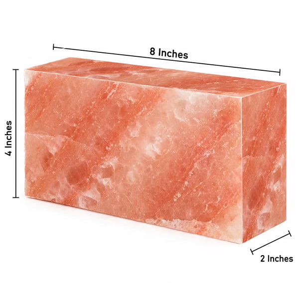 A rectangular pink stone block with dimension labels showing 8 inches across the top, 4 inches on the left side, and 2 inches on the front face, on a white background.