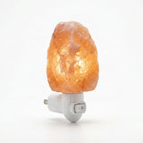 Himalayan salt lamp with a plug on a white background
